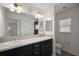 Well-lit bathroom featuring double sinks and a large mirror at 3305 Dzuro Dr, Oxford, FL 34484