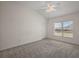 Bright bedroom with large window offering natural light and a view at 3305 Dzuro Dr, Oxford, FL 34484