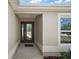 Inviting home entrance featuring a decorative glass front door and neutral stucco wall at 3305 Dzuro Dr, Oxford, FL 34484