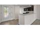 View of modern kitchen with stainless steel appliances and dark cabinets at 3305 Dzuro Dr, Oxford, FL 34484