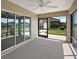 A covered lanai with sliding doors and ceiling fan provides outdoor living at 3305 Dzuro Dr, Oxford, FL 34484