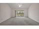 Spacious living room with large glass doors leading to the outside at 3305 Dzuro Dr, Oxford, FL 34484