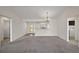 Open-concept room with view of the entryway and laundry room at 3305 Dzuro Dr, Oxford, FL 34484