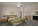 Comfortable main bedroom with tasteful decor, vanity and ensuite bathroom at 3305 Dzuro Dr, Oxford, FL 34484