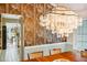 Formal dining room with decorative peacock wallpaper and a unique capiz shell chandelier at 333 Stanley Bell Dr, Mount Dora, FL 32757