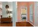 Warm home entryway featuring parquet floors, opening to the bedroom and showcasing stylish decor at 333 Stanley Bell Dr, Mount Dora, FL 32757