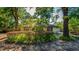 Charming one-story home featuring a well-maintained yard, mature trees, and vibrant landscaping at 333 Stanley Bell Dr, Mount Dora, FL 32757