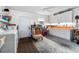 Garage features laundry, storage cabinets, work bench, and a chair at 333 Stanley Bell Dr, Mount Dora, FL 32757