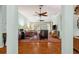 Spacious living room with hardwood floors, multiple ceiling fans, and large windows offering ample natural light at 333 Stanley Bell Dr, Mount Dora, FL 32757