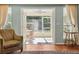 Screened patio featuring bright sunlight, ceiling fan, and outdoor dining table and chairs at 333 Stanley Bell Dr, Mount Dora, FL 32757