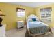 Bright bedroom with yellow walls, two windows letting in natural light, and comfortable sleeping arrangements at 33801 Picciola Dr, Fruitland Park, FL 34731