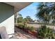 Charming view from the front porch of a home with mature landscaping and nearby water views at 33801 Picciola Dr, Fruitland Park, FL 34731