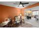 Home office featuring a desk, chair, lamp and view to living room at 33801 Picciola Dr, Fruitland Park, FL 34731