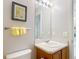 Well-lit bathroom with a vanity, mirror, and fresh decor at 3614 Auburndale Ave, The Villages, FL 32162