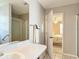 Comfortable bathroom with a vanity and a view of the bedroom through the open door at 3614 Auburndale Ave, The Villages, FL 32162
