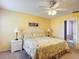 Bright bedroom with floral bedding, matching lamps, and bedside tables with carpeted floors at 3614 Auburndale Ave, The Villages, FL 32162