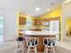 Bright and modern kitchen with a large island and plenty of counter space at 3614 Auburndale Ave, The Villages, FL 32162
