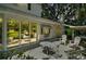 Outdoor patio with tables, chairs, and awning, perfect for relaxation at 3630 Oak St, Mount Dora, FL 32757