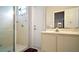 Bathroom featuring a walk-in shower, vanity sink, and white cabinets at 3630 Oak St, Mount Dora, FL 32757