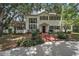 Charming two-story home featuring a brick walkway and lush landscaping for added curb appeal at 3630 Oak St, Mount Dora, FL 32757