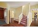 Entryway with warm wood flooring, stairs to the second level, and access to multiple rooms at 3630 Oak St, Mount Dora, FL 32757