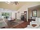 Open living room featuring hardwood floors, a dining nook, and stylish furniture arrangement at 3630 Oak St, Mount Dora, FL 32757