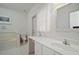 Bright main bathroom with a large vanity, soaking tub, and ample lighting at 3630 Oak St, Mount Dora, FL 32757