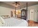 Spacious primary bedroom includes sitting area, wet bar, and ensuite bathroom at 3630 Oak St, Mount Dora, FL 32757
