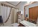 Bathroom featuring a vanity sink, toilet and bathtub with shower at 37945 Monticello St, Leesburg, FL 34788