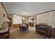 Charming dining area with a dining table, piano, and connection to the kitchen at 37945 Monticello St, Leesburg, FL 34788