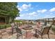 Outdoor fire pit with seating area, ideal for enjoying the lakeside views at 37945 Monticello St, Leesburg, FL 34788