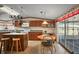 Functional kitchen with an island, breakfast nook, and ample cabinet space at 37945 Monticello St, Leesburg, FL 34788