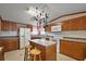 Well-equipped kitchen featuring an island with seating, ample cabinet space, and modern appliances at 37945 Monticello St, Leesburg, FL 34788