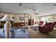 Comfortable living room featuring a fireplace, sofa, and classic decor at 37945 Monticello St, Leesburg, FL 34788