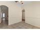 Dining room featuring tile flooring, neutral walls, and passageways into the kitchen and living spaces at 38420 Langlois Pl, Leesburg, FL 34788
