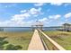The private dock provides direct access to the calm waters of the lake at 38420 Langlois Pl, Leesburg, FL 34788