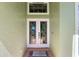 Elegant double front doors with decorative glass, providing a welcoming entrance to the home at 38420 Langlois Pl, Leesburg, FL 34788
