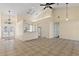 Open-concept living area with a breakfast bar connecting to the kitchen, perfect for entertaining and casual dining at 38420 Langlois Pl, Leesburg, FL 34788