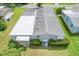 Birds eye view of the back of the property showcasing the roof and mature landscaping at 432 King Way, Tavares, FL 32778