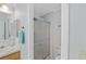 A cozy bathroom with a vanity, sink, and enclosed shower with glass doors at 432 King Way, Tavares, FL 32778