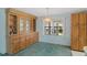 Charming dining area boasting a custom built-in, elegant lighting, and natural light at 432 King Way, Tavares, FL 32778