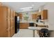 Bright kitchen with efficient appliances, a convenient breakfast bar, and ample storage at 432 King Way, Tavares, FL 32778