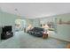 Open-concept living area with a large sofa, and plenty of natural light for comfortable everyday living at 432 King Way, Tavares, FL 32778