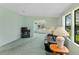 Inviting living room featuring bright light, plush carpet, and an open floor plan at 432 King Way, Tavares, FL 32778