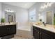 Luxurious bathroom features dual vanities, soaking tub, and modern finishes at 4515 Lions Gate Ave, Clermont, FL 34711