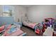 Cozy ' bedroom with twin beds, soft carpet, and ample space for play and decor at 4515 Lions Gate Ave, Clermont, FL 34711