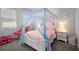 Bright bedroom featuring a whimsical canopy bed and playful decor at 4515 Lions Gate Ave, Clermont, FL 34711