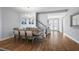 Chic dining room featuring a wooden table, elegant chandelier, and an open entrance at 4515 Lions Gate Ave, Clermont, FL 34711