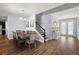 Elegant dining room boasting a wooden table, staircase access, and stylish decor at 4515 Lions Gate Ave, Clermont, FL 34711