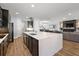 Contemporary kitchen with island, stainless steel appliances, and an open layout to the living room at 4515 Lions Gate Ave, Clermont, FL 34711
